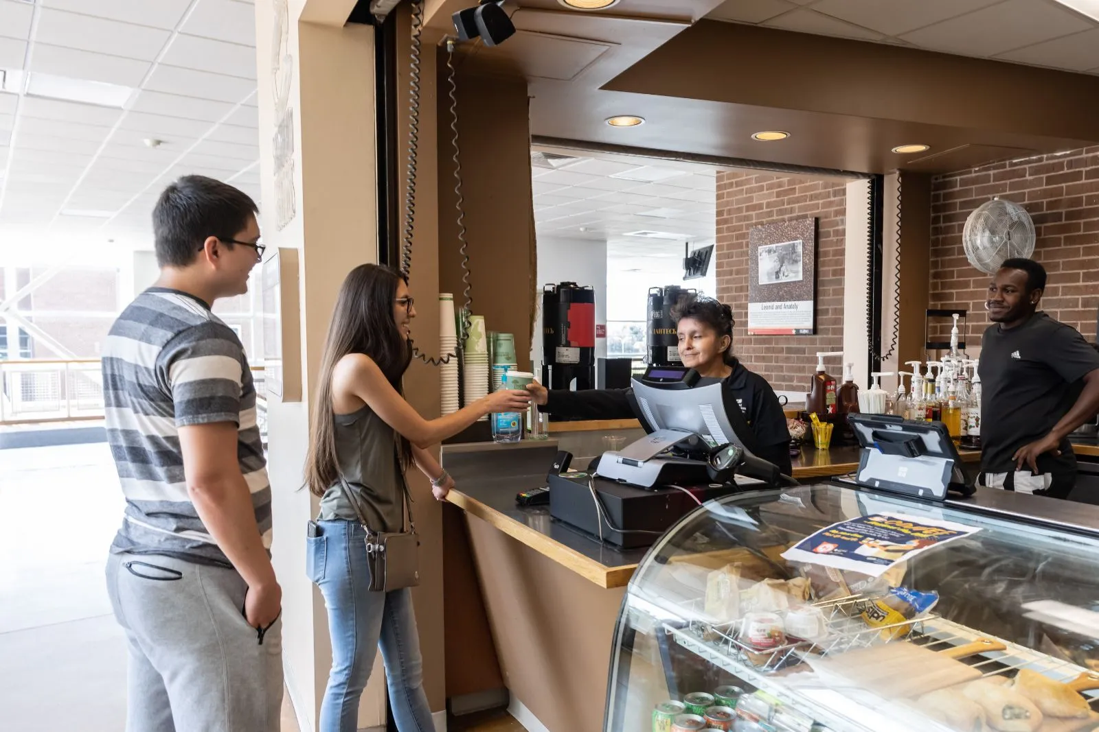 students paying at the UC coffee shop